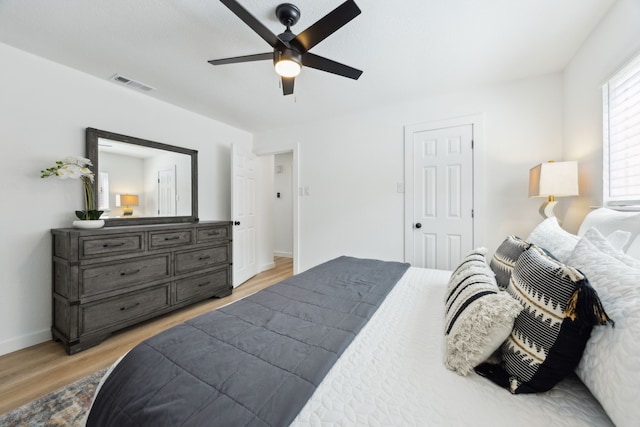 1833 Chamberlain Dr, Carrollton, TX 75007 - bedroom with light wood-type flooring, baseboards, and a ceiling fan