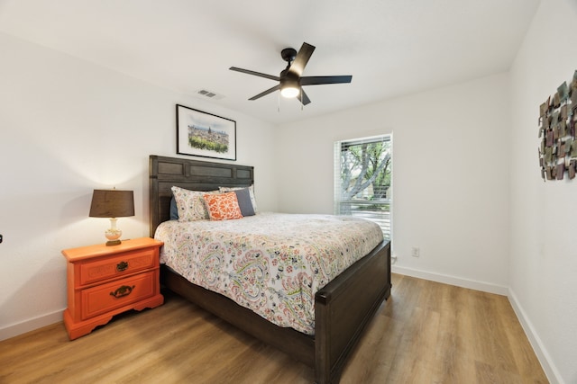 1833 Chamberlain Dr, Carrollton, TX 75007 - bedroom featuring light wood-style flooring, baseboards, and ceiling fan