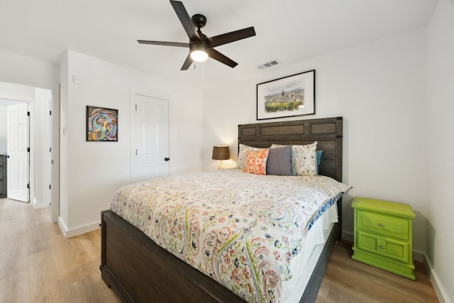 1833 Chamberlain Dr, Carrollton, TX 75007 - bedroom featuring light wood-style floors, baseboards, and a ceiling fan