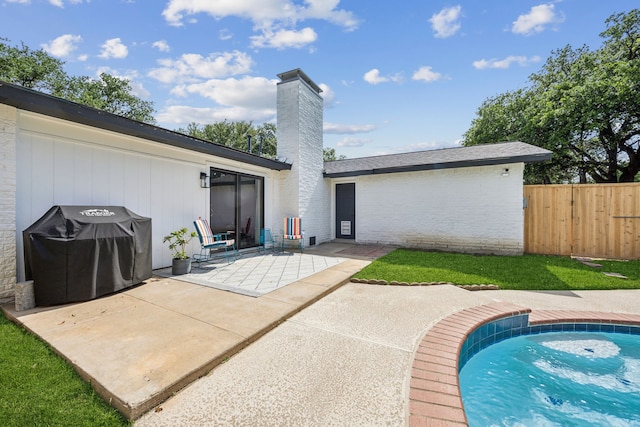 1833 Chamberlain Dr, Carrollton, TX 75007 - back of house featuring a chimney, a patio, and brick siding
