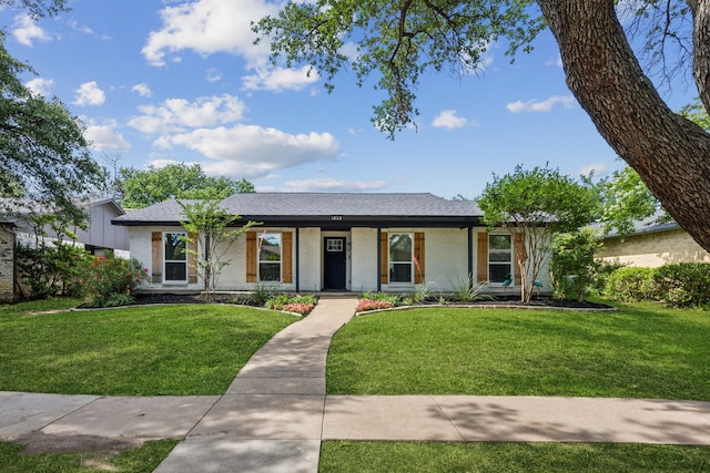 1833 Chamberlain Dr, Carrollton, TX 75007 - single story home featuring a front yard, brick siding, covered porch, and roof with shingles