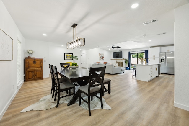 1833 Chamberlain Dr, Carrollton, TX 75007 - dining room featuring light wood-type flooring, recessed lighting, baseboards, and ceiling fan