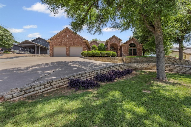 4223 Mojave Dr, Granbury, TX 76049 - traditional home featuring driveway, a garage, a front yard, and brick siding