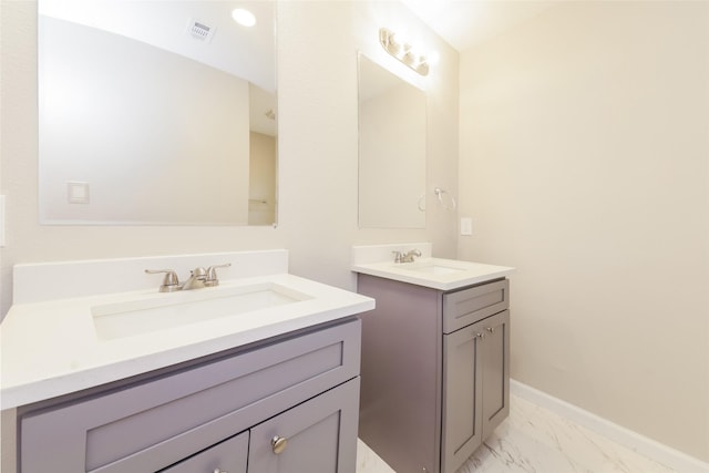 3343 Norcross Ln, Dallas, TX 75229 - full bathroom with two vanities, marble finish floors, and baseboards