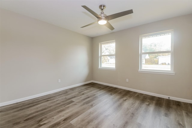 3343 Norcross Ln, Dallas, TX 75229 - empty room with wood finished floors, baseboards, and a ceiling fan