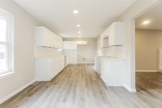 3343 Norcross Ln, Dallas, TX 75229 - kitchen with decorative backsplash, light wood-style flooring, recessed lighting, and baseboards