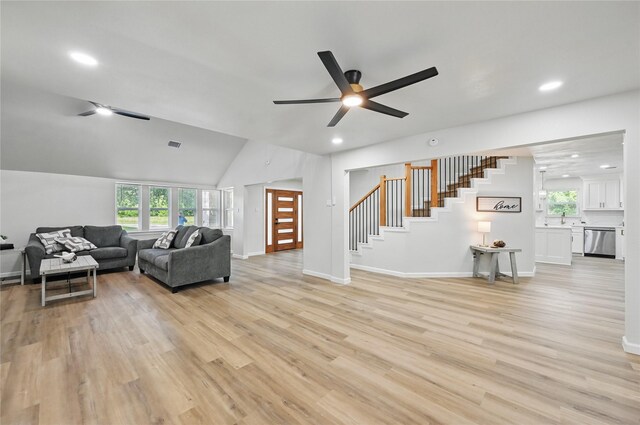 9690 Fallbrook Dr, Dallas, TX 75243 - living room featuring stairway, a ceiling fan, healthy amount of natural light, light wood-style floors, and recessed lighting