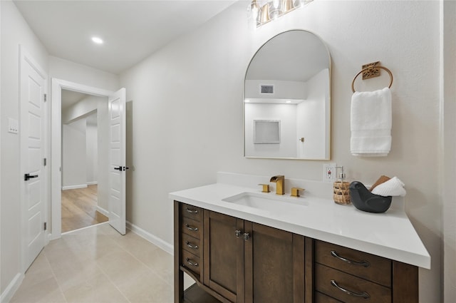 9690 Fallbrook Dr, Dallas, TX 75243 - bathroom with vanity, baseboards, tile patterned floors, and recessed lighting