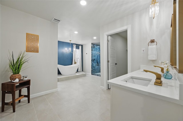 9690 Fallbrook Dr, Dallas, TX 75243 - bathroom with double vanity, recessed lighting, a soaking tub, a chandelier, and baseboards