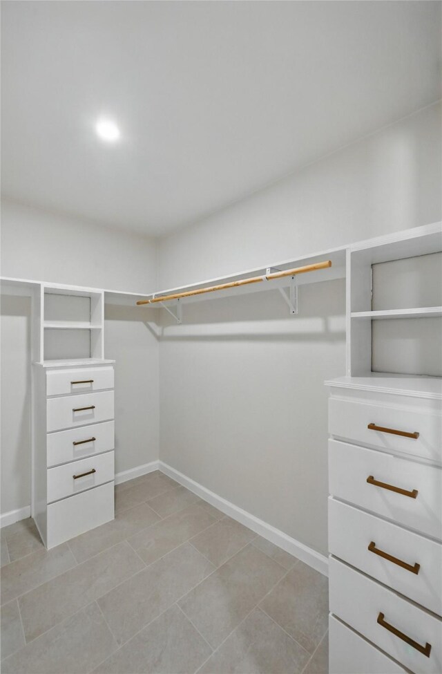9690 Fallbrook Dr, Dallas, TX 75243 - spacious closet with light tile patterned flooring