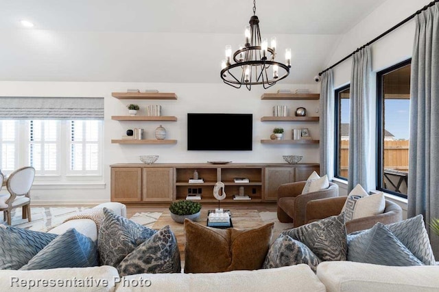 11749 Edgewood Dr, Justin, TX 76247 - living area with a chandelier, light wood-style flooring, and vaulted ceiling