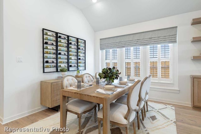 11749 Edgewood Dr, Justin, TX 76247 - dining space with light wood finished floors, baseboards, and lofted ceiling