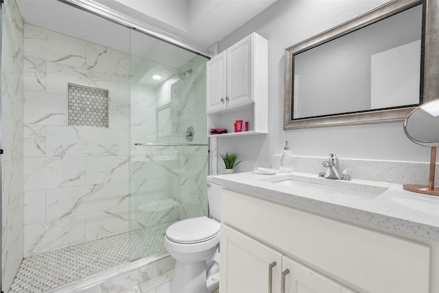 2937 Lake Park Dr, Grand Prairie, TX 75052 - full bathroom featuring marble look tiles, a marble finish shower, vanity, and toilet