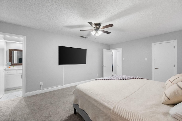 2937 Lake Park Dr, Grand Prairie, TX 75052 - bedroom with ensuite bath, light carpet, a textured ceiling, baseboards, and a ceiling fan