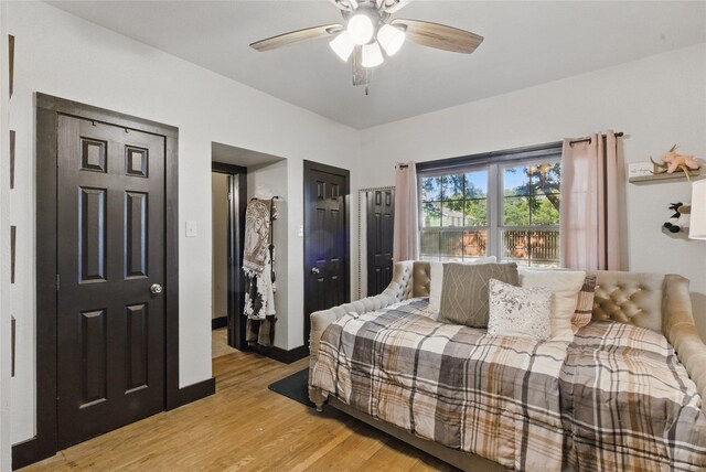 8700 Fm 920, Peaster, TX 76088 - bedroom featuring light wood finished floors, ceiling fan, and two closets