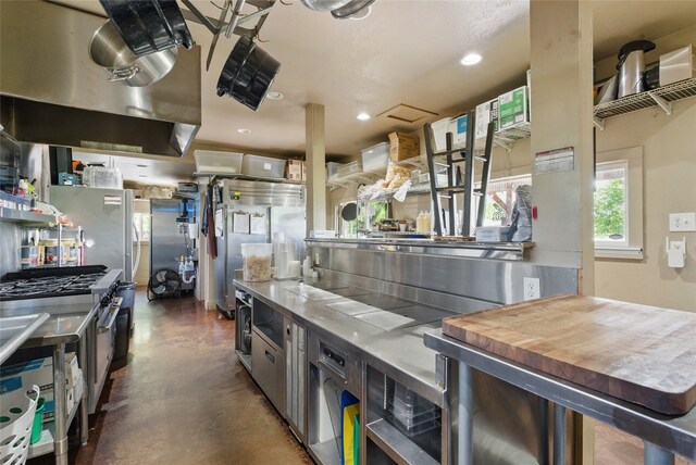 8700 Fm 920, Peaster, TX 76088 - kitchen featuring finished concrete flooring, stainless steel counters, stainless steel range, recessed lighting, and exhaust hood