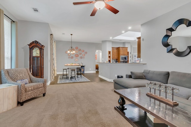 6504 Bluebird Dr, Arlington, TX 76001 - living room with ceiling fan, carpet floors, recessed lighting, arched walkways, and baseboards