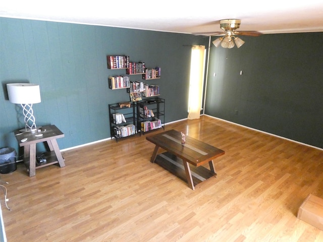 1922 Rambling Ridge Ln, Carrollton, TX 75007 - living area featuring ceiling fan, light wood finished floors, and baseboards