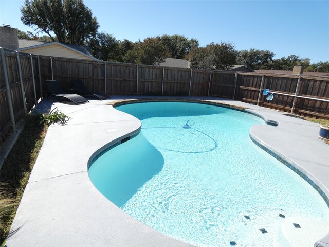 1922 Rambling Ridge Ln, Carrollton, TX 75007 - view of swimming pool featuring a fenced backyard and a patio