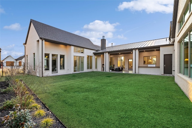 206 Laila Ct, Colleyville, TX 76034 - rear view of house featuring a standing seam roof, a chimney, metal roof, and a patio