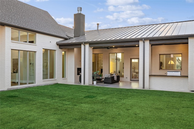 206 Laila Ct, Colleyville, TX 76034 - rear view of property featuring a standing seam roof, brick siding, an outdoor living space, a chimney, and a patio area