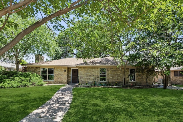 2310 Bengal Ln, Plano, TX 75023 - ranch-style home with a front lawn, brick siding, and a chimney