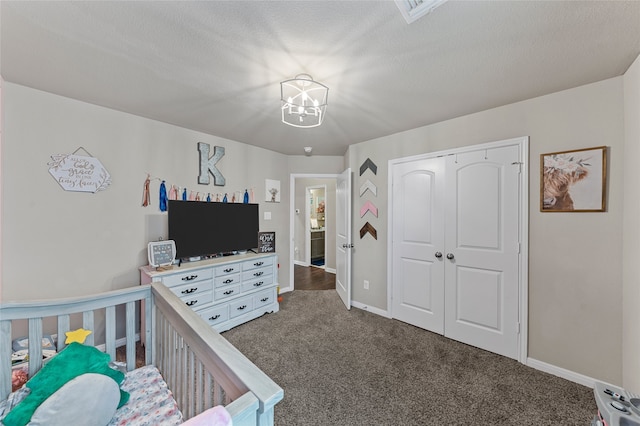 3224 Risinger Rd, Waco, TX 76655 - carpeted bedroom with baseboards, a closet, and a chandelier