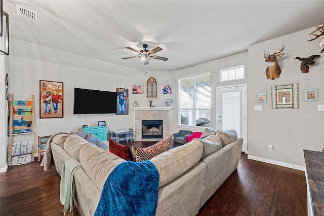 3224 Risinger Rd, Waco, TX 76655 - living room with dark wood finished floors, ceiling fan, baseboards, and a fireplace