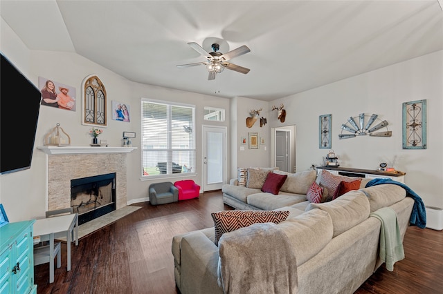 3224 Risinger Rd, Waco, TX 76655 - living room with a ceiling fan, a stone fireplace, and dark wood-style floors