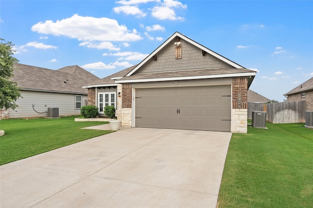 3224 Risinger Rd, Waco, TX 76655 - view of front of property with central air condition unit, an attached garage, and driveway