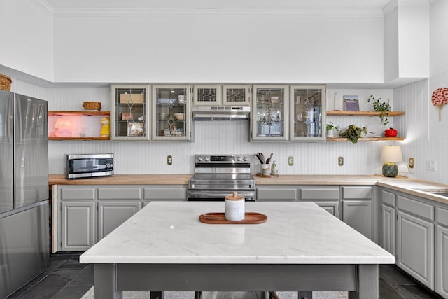 616 Crowley Rd, Arlington, TX 76012 - kitchen featuring appliances with stainless steel finishes, under cabinet range hood, open shelves, gray cabinetry, and ornamental molding