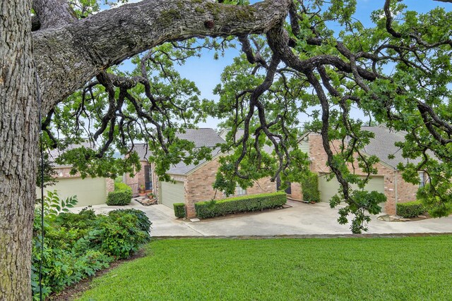 616 Crowley Rd, Arlington, TX 76012 - view of grassy yard featuring concrete driveway and a garage