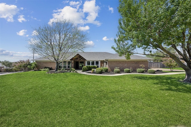 7101 Odell Ave, Rockwall, TX 75087 - ranch-style house featuring brick siding
