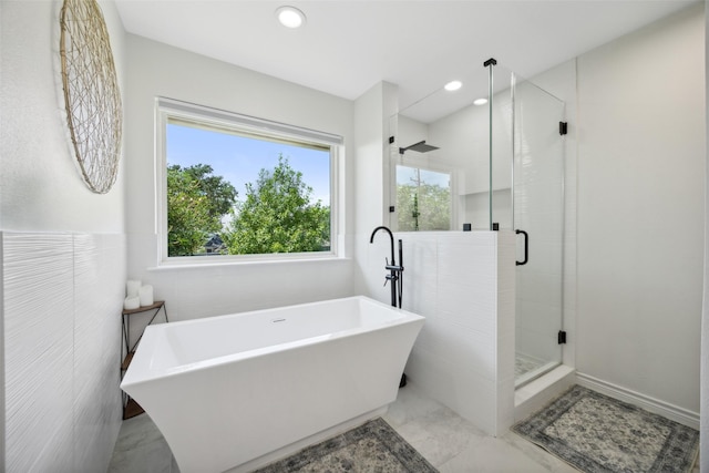 7101 Odell Ave, Rockwall, TX 75087 - bathroom featuring a soaking tub, a stall shower, recessed lighting, and marble finish flooring