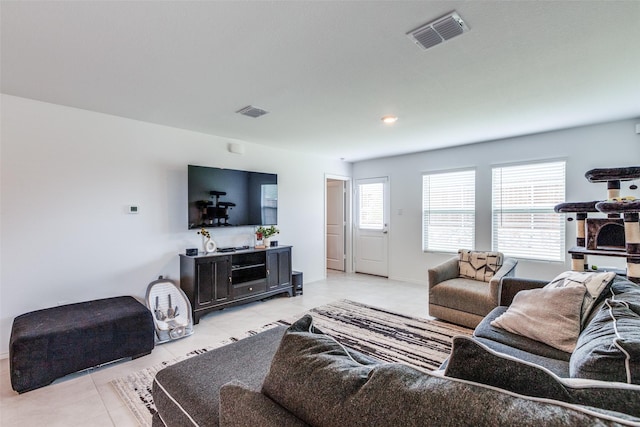 14069 Drover St, Pilot Point, TX 76258 - living area featuring light tile patterned floors and baseboards