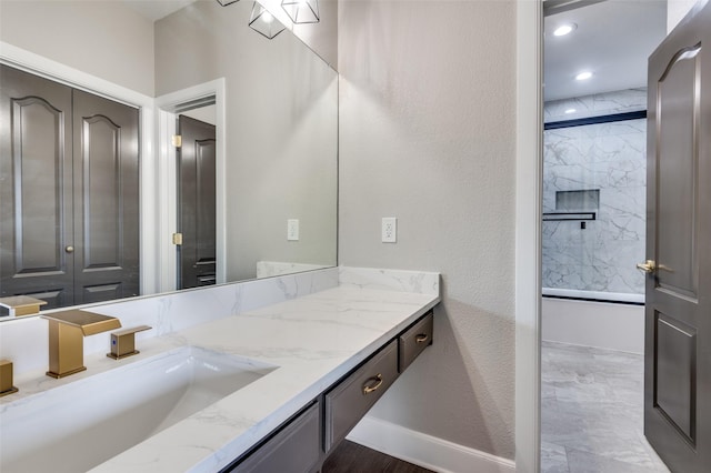 2007 Hill Country Ct, Arlington, TX 76012 - full bathroom featuring vanity, baseboards, a shower, a textured wall, and recessed lighting