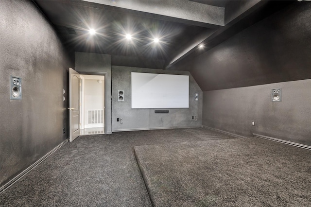 2007 Hill Country Ct, Arlington, TX 76012 - carpeted home theater room featuring lofted ceiling, baseboards, and a textured wall