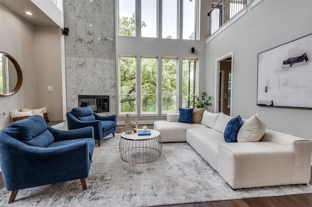 2007 Hill Country Ct, Arlington, TX 76012 - living room featuring a towering ceiling, wood finished floors, and a fireplace