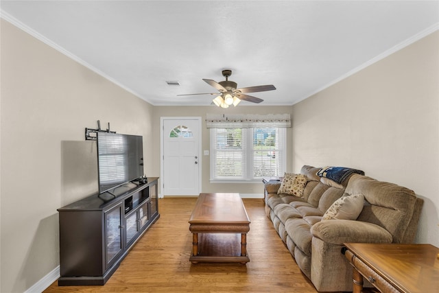 4113 Crestview Dr, Fort Worth, TX 76103 - living area featuring light wood-style floors, baseboards, ceiling fan, and crown molding