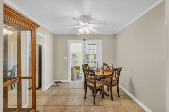 4113 Crestview Dr, Fort Worth, TX 76103 - dining space featuring a ceiling fan, baseboards, crown molding, and light tile patterned floors