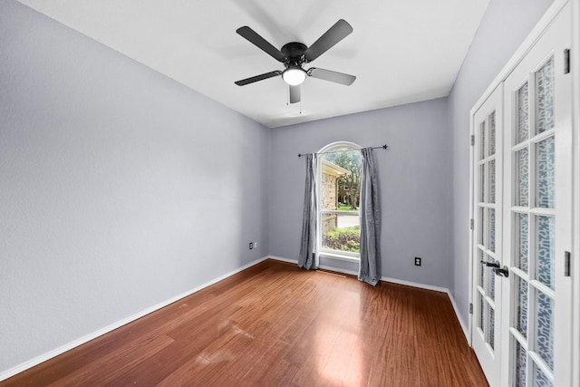741 Oak Dale Ave, Lake Dallas, TX 75065 - unfurnished room with wood finished floors, baseboards, french doors, and a ceiling fan