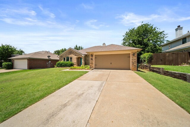 741 Oak Dale Ave, Lake Dallas, TX 75065 - view of front of home featuring brick siding, a garage, and driveway