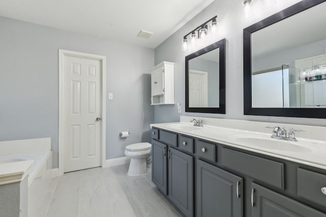 5708 Pebble Ridge Dr, Mckinney, TX 75070 - bathroom with double vanity, a garden tub, toilet, a shower with shower door, and baseboards