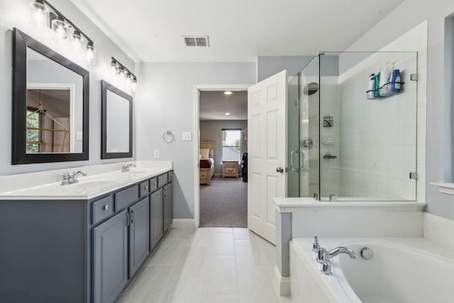 5708 Pebble Ridge Dr, Mckinney, TX 75070 - bathroom with a bath, double vanity, ensuite bathroom, tiled shower, and baseboards