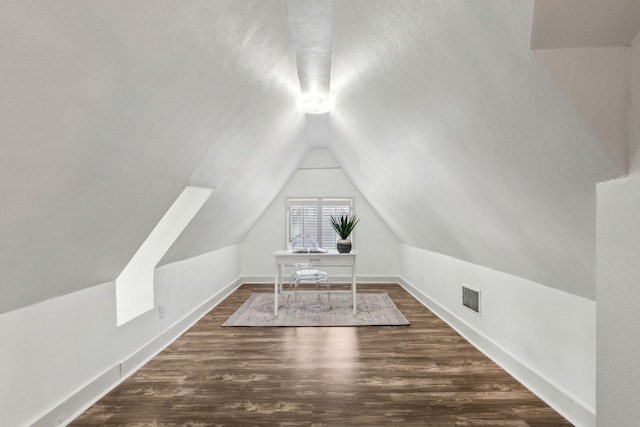 5510 Monticello Ave, Dallas, TX 75206 - additional living space with dark wood-style flooring, lofted ceiling, baseboards, an office area, and a textured ceiling