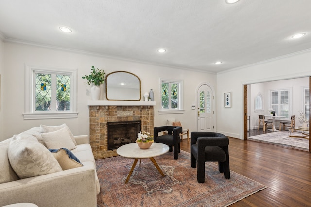 5510 Monticello Ave, Dallas, TX 75206 - living room with crown molding, recessed lighting, plenty of natural light, dark wood-type flooring, and a tile fireplace