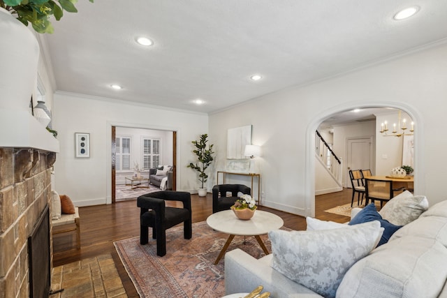 5510 Monticello Ave, Dallas, TX 75206 - living room with arched walkways, ornamental molding, a fireplace, recessed lighting, and baseboards