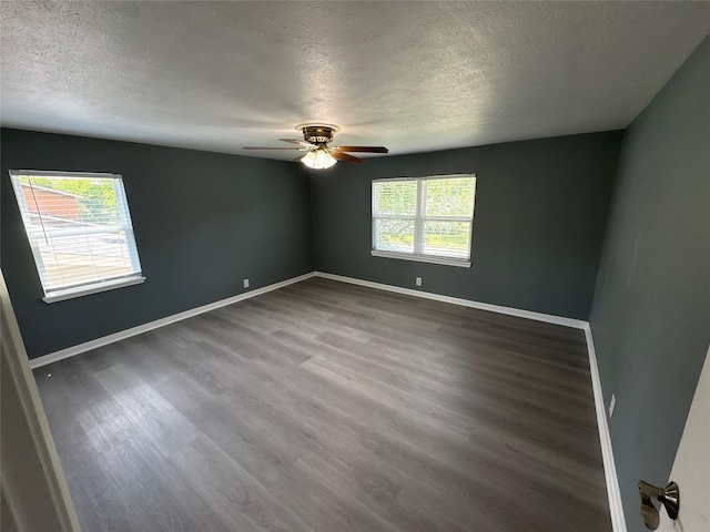2401 N Alexander St, Sherman, TX 75092 - spare room featuring a textured ceiling, wood finished floors, baseboards, and ceiling fan