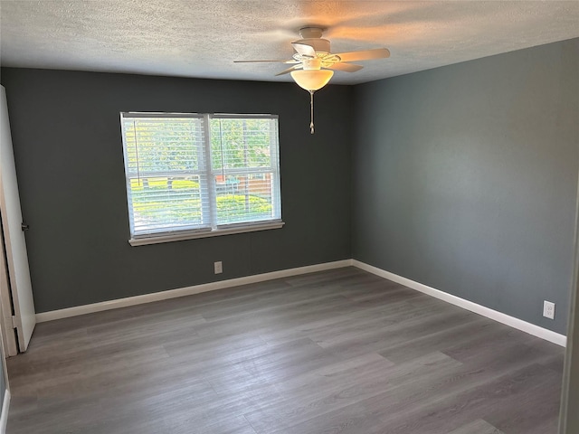 2401 N Alexander St, Sherman, TX 75092 - unfurnished room featuring a textured ceiling, a ceiling fan, wood finished floors, and baseboards