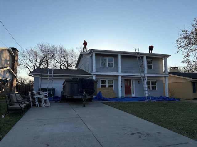 2401 N Alexander St, Sherman, TX 75092 - back of house featuring driveway and a lawn